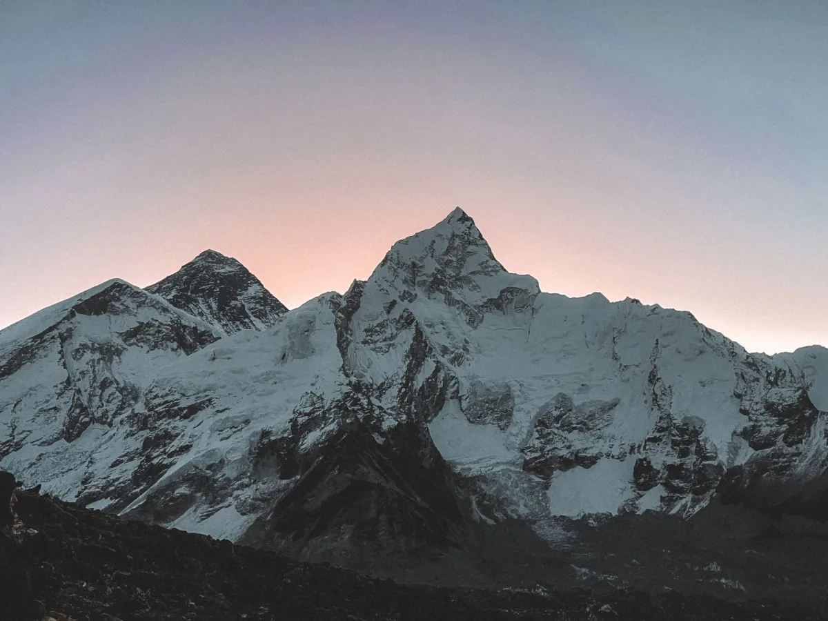 Stunning snowcapped mountains at sunset. Perfect dusk landscape for nature lovers.