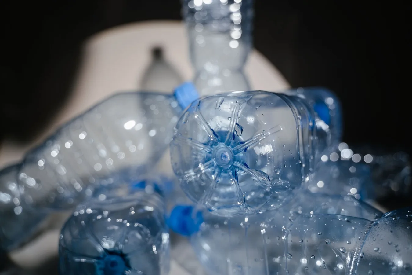 Detailed close-up of used plastic bottles ready for recycling, highlighting environmental